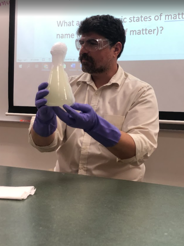 Andrew Horvath teaching in a science lab classroom